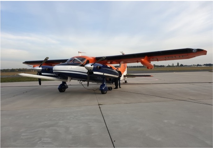 The research aircraft dornier-do128 facing westward while grounded on a clear day